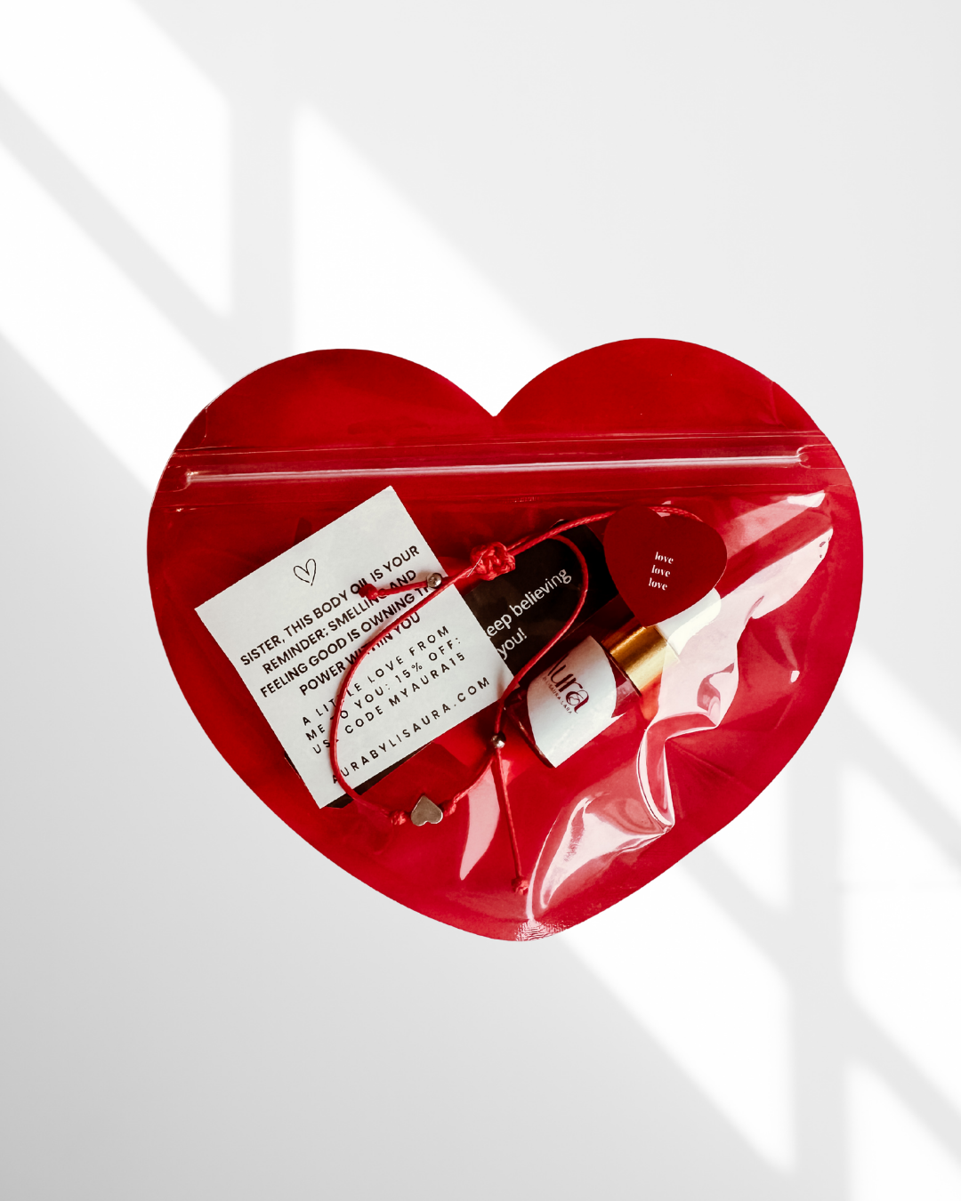 Gift heart with Aura Shimmering Dry Body Oil + Never Alone Bracelet